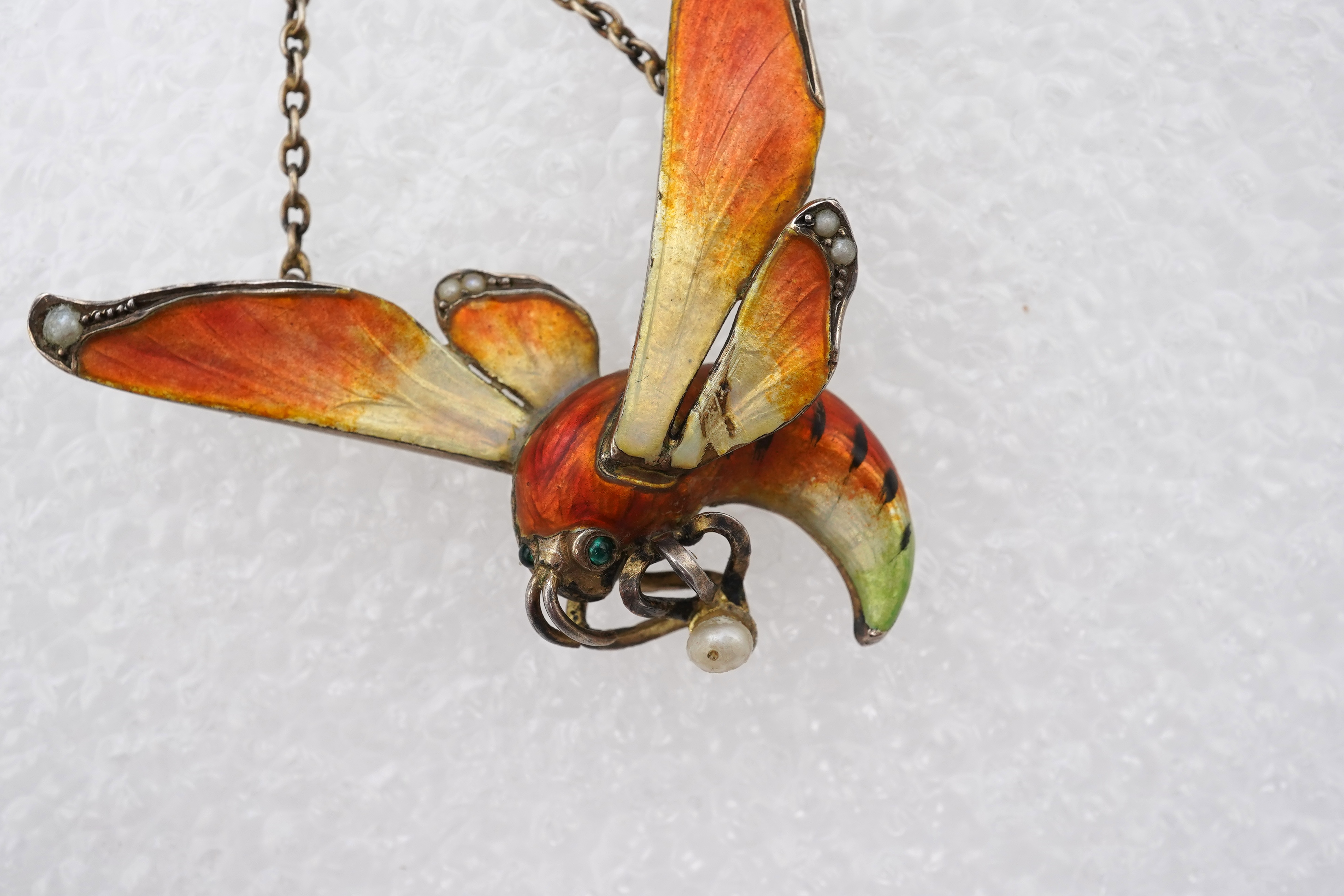 An unusual Art Nouveau silver gilt and enamel pendant, circa 1900